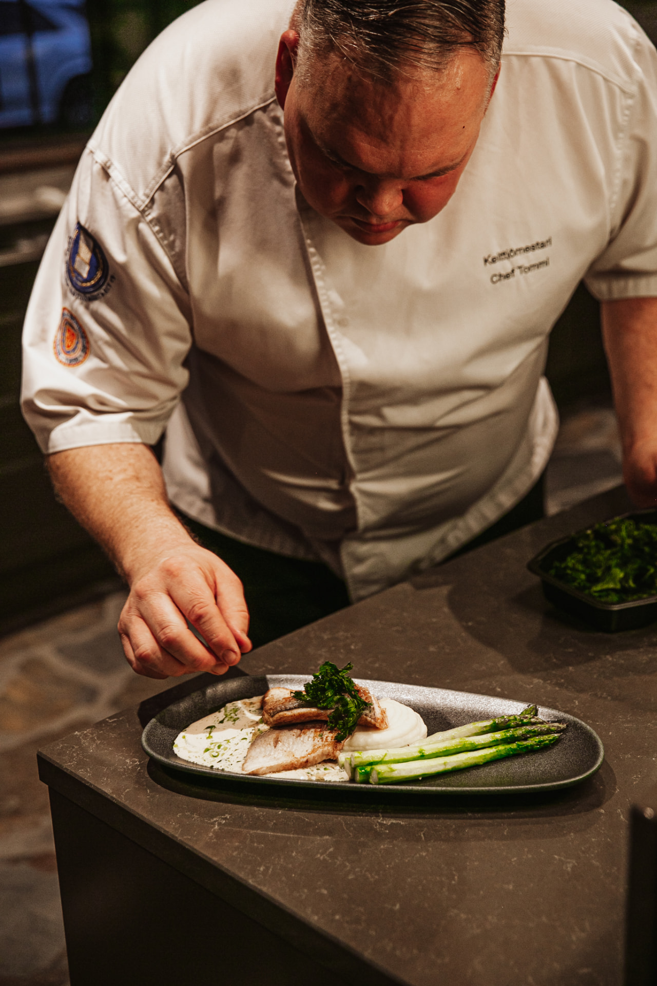 Private chef at work in the manor kitchen at Neituri Manor in Konnevesi, Finland
