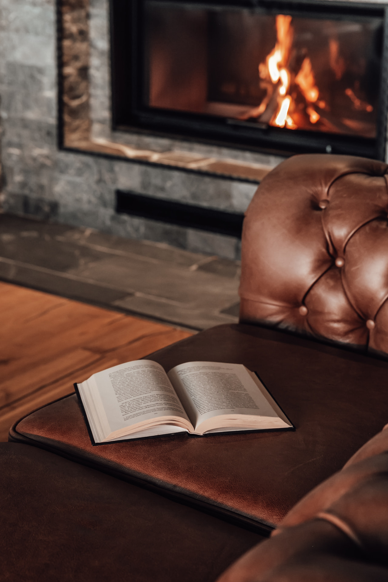 Fireside living room in the great hall of Neituri Manor, a private countryside retreat in Finland