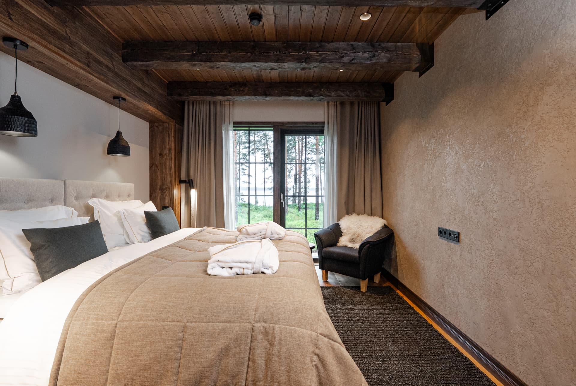 Guest suite with robes and a view of the lake, exclusive group accommodation at Neituri Manor